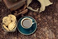 Coffee cup and beans, old grinder and jute sack Royalty Free Stock Photo