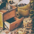 Coffee cup, beans and old grinder, toned photo Royalty Free Stock Photo