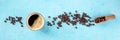 Coffee cup and beans panorama, overhead flat lay shot on a blue background Royalty Free Stock Photo