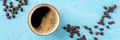 Coffee cup and beans panorama, top flat lay shot on a blue background Royalty Free Stock Photo