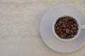 Coffee cup and beans on a white background. Top view with copy space for your text Royalty Free Stock Photo