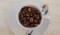 Coffee cup and beans on a white background. Top view with copy space for your text Royalty Free Stock Photo