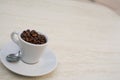 Coffee cup and beans on a white background. Top view with copy space for your text Royalty Free Stock Photo