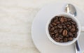 Coffee cup and beans on a white background. Top view with copy space for your text Royalty Free Stock Photo