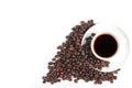 Coffee cup and beans on a white background, top view of a cup of coffee and a pile of coffee beans Royalty Free Stock Photo