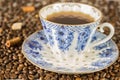 Coffee Cup and beans on wooden table background beautiful,vintage blue color tone Royalty Free Stock Photo