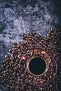 Coffee. Cup of black coffee and spilled coffee beans. Coffee break Royalty Free Stock Photo