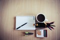 Coffee cup, calculator, stapler, notebook, colorful pen