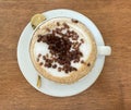 Coffee cup of cappuccino with black sugar Royalty Free Stock Photo