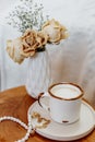 Coffee cup cappuccino, vintage dried flowers, cozy home