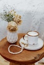 Coffee cup cappuccino, vintage dried flowers, cozy home.