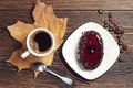 Coffee cup and chocolate cake with cherry jelly Royalty Free Stock Photo