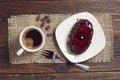 Coffee cup and chocolate cake with cherry jelly Royalty Free Stock Photo