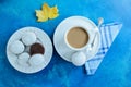 The coffee cup with chocolate gingerbreads with white glaze. Autumn maple leaf.