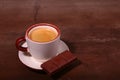 Coffee cup and chocolate on wooden table texture. Coffeebreak Royalty Free Stock Photo