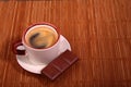 Coffee cup and chocolate on wooden table texture. Coffeebreak Royalty Free Stock Photo