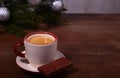 Coffee cup and chocolate on wooden table texture. Coffeebreak. Christmas time Royalty Free Stock Photo