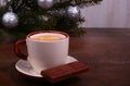 Coffee cup and chocolate on wooden table texture. Coffeebreak. Christmas time Royalty Free Stock Photo