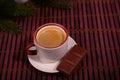 Coffee cup and chocolate on wooden table texture. Coffeebreak. Christmas time Royalty Free Stock Photo