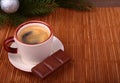 Coffee cup and chocolate on wooden table texture. Coffeebreak. Christmas time Royalty Free Stock Photo