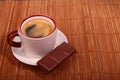 Coffee cup and chocolate on wooden table texture. Coffeebreak Royalty Free Stock Photo