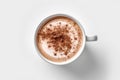 Coffee cup with cocoa powder on white background, top view. Royalty Free Stock Photo