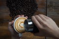 Coffee Cup with Coffee Beans in the Background Royalty Free Stock Photo