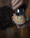 Coffee Cup with Coffee Beans in the Background Royalty Free Stock Photo