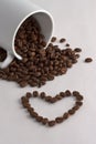 Coffee cup, coffee beans and heart Royalty Free Stock Photo