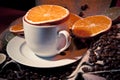 Coffee cup with coffee beans, orange and lemon Royalty Free Stock Photo