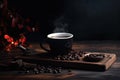 Coffee cup and coffee beans on a wooden table. Black background. A cup of hot dark coffee with aromatic roasted coffee beans on Royalty Free Stock Photo