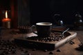 Coffee cup and coffee beans on a wooden table. Dark background. A cup of hot dark coffee with aromatic roasted coffee beans on top Royalty Free Stock Photo