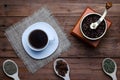 Coffee cup, coffee grinder and spices on a wooden table, top vie Royalty Free Stock Photo