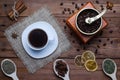 Coffee cup, coffee grinder and spices on a wooden table, top vie Royalty Free Stock Photo