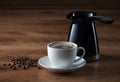 Coffee cup, coffee pot and beans on wooden texture Royalty Free Stock Photo