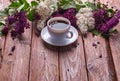 Coffee Cup And Colorful Lilac Flowers Royalty Free Stock Photo