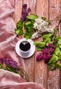 Coffee Cup And Colorful Lilac Flowers Royalty Free Stock Photo