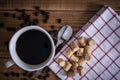 Coffee cup and cookie collon on wooden background. Royalty Free Stock Photo