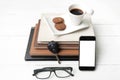 Coffee cup with cookie,phone,stack of book and car key Royalty Free Stock Photo