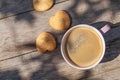 Coffee cup and cookies on garden table Royalty Free Stock Photo