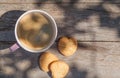 Coffee cup and cookies on garden table Royalty Free Stock Photo
