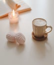 coffee cup, flower, candle and a book on a white table background top view Royalty Free Stock Photo