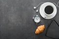 coffee cup with croissant and alarm clock, black glasses, white Royalty Free Stock Photo