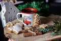 Captivating Festive Delights: Homemade Cookies and Retro Coffee Cup on a Rustic Wooden Desk
