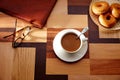 Coffee cup and dona with glasses on table retro Royalty Free Stock Photo