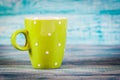 Coffee cup with dots good morning on blue rustic background, breakfast on Mothers day or Womens day. Free space for your Royalty Free Stock Photo