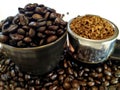 Coffee cup filled with coffee beans, portafilter filled with ground coffee, coffee beans scattered between the scarf and porta