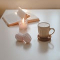 coffee cup, flower, candle and a book on a white table background top view Royalty Free Stock Photo