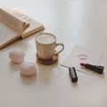 coffee cup, flower, candle and a book on a white table background top view Royalty Free Stock Photo