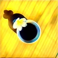 Coffee cup with frangipani flower on table. Flat lay digital illustration.